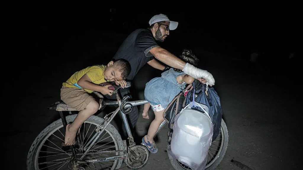 ‘The bombing has been insane’: Palestinians scramble to flee Israeli assault on Gaza City